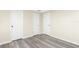 Bedroom with wood-look floors and double closets at 850 E 2Nd St, Englewood, FL 34223