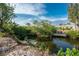 Private dock on a tranquil canal with lush vegetation at 850 E 2Nd St, Englewood, FL 34223