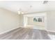 Bright dining area with wood-look floors and view of living room at 850 E 2Nd St, Englewood, FL 34223