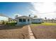 Front view of charming light blue home at 850 E 2Nd St, Englewood, FL 34223