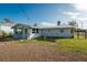 Side view of the light blue house at 850 E 2Nd St, Englewood, FL 34223