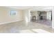 Bright living room with tile flooring and open view to kitchen at 850 E 2Nd St, Englewood, FL 34223