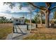 White storage shed with metal roof in backyard at 850 E 2Nd St, Englewood, FL 34223