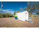 White storage shed with kayaks and ramp at 850 E 2Nd St, Englewood, FL 34223