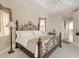 Bright bedroom with king-size bed and large windows at 110 Barracuda Dr, Placida, FL 33946