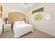 Cozy bedroom with a queen-size bed and neutral decor at 110 Barracuda Dr, Placida, FL 33946