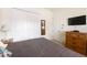 Guest bedroom with a large closet and TV at 110 Barracuda Dr, Placida, FL 33946