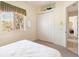 Comfortable bedroom with a queen bed and built-in closet at 110 Barracuda Dr, Placida, FL 33946