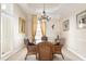 Formal dining room with a glass-top table and wicker chairs at 110 Barracuda Dr, Placida, FL 33946