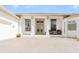 White house with columns,tan roof,and a paved driveway at 110 Barracuda Dr, Placida, FL 33946