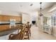 Kitchen with breakfast bar, view into living room and pool at 110 Barracuda Dr, Placida, FL 33946