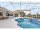 Resort-style pool and spa with outdoor seating at 110 Barracuda Dr, Placida, FL 33946