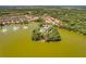 Aerial view of community with lake and multiple homes at 11479 Blackfin St, Venice, FL 34292