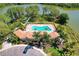 Community pool and clubhouse with lakefront views at 11479 Blackfin St, Venice, FL 34292