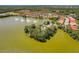 Aerial view of community with lake and fountains at 11479 Blackfin St, Venice, FL 34292