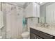 Clean bathroom with granite vanity and floral shower curtain at 11479 Blackfin St, Venice, FL 34292