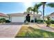 Single-story home with a brick driveway and landscaped yard at 11479 Blackfin St, Venice, FL 34292