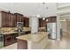 Modern kitchen with stainless steel appliances and granite at 11479 Blackfin St, Venice, FL 34292