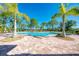 Resort-style pool with palm trees and patio at 11479 Blackfin St, Venice, FL 34292