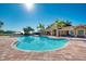 Community pool with lake view and palm trees at 11479 Blackfin St, Venice, FL 34292