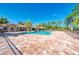 Community pool with lounge chairs and clubhouse at 11479 Blackfin St, Venice, FL 34292