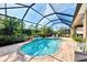 Relax by the refreshing pool within this screened patio at 11479 Blackfin St, Venice, FL 34292