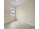 Simple bedroom with light walls and wood-look floors at 1171 Yarmouth St, Port Charlotte, FL 33952