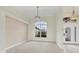 Spacious dining area with large window and chandelier at 1171 Yarmouth St, Port Charlotte, FL 33952