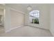 Bright dining room with arched window and hardwood floors at 1171 Yarmouth St, Port Charlotte, FL 33952