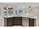 Kitchen island with granite countertop and stainless steel dishwasher at 1171 Yarmouth St, Port Charlotte, FL 33952