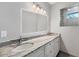 Elegant bathroom with double sinks and a walk-in shower at 119 White Pine Dr, Rotonda West, FL 33947