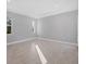 Spacious bedroom with light grey walls and tile flooring at 119 White Pine Dr, Rotonda West, FL 33947