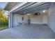 Attached garage with epoxy flooring and extra storage at 119 White Pine Dr, Rotonda West, FL 33947