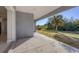 Covered patio with sliding glass doors overlooking backyard at 119 White Pine Dr, Rotonda West, FL 33947