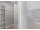 Large walk-in closet with shelves and hanging rod at 119 White Pine Dr, Rotonda West, FL 33947