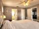 Main bedroom with a king-size bed and access to another room at 13278 Carter Ave, Port Charlotte, FL 33981