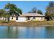 Single-story house with a view of a lake at 13278 Carter Ave, Port Charlotte, FL 33981