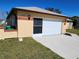 Attached garage with screen door and ample parking space at 13278 Carter Ave, Port Charlotte, FL 33981