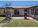 Backyard patio with pergola and sliding glass doors at 13278 Carter Ave, Port Charlotte, FL 33981