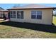 Back of house, showing windows and sunroom at 13278 Carter Ave, Port Charlotte, FL 33981