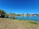 Tranquil lake view with lush greenery at 13278 Carter Ave, Port Charlotte, FL 33981