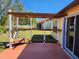 Backyard patio with pergola and wooden deck at 13278 Carter Ave, Port Charlotte, FL 33981