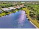 Aerial view of a tranquil community with waterfront homes and lush landscaping at 13376 Creekside Ln, Port Charlotte, FL 33953