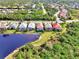 Aerial view showcasing a luxury home with a private pool and backyard at 13376 Creekside Ln, Port Charlotte, FL 33953