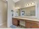 Spacious bathroom with double vanity and a large mirror at 13376 Creekside Ln, Port Charlotte, FL 33953