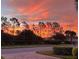 Beautiful sunset view over the community landscape at 13376 Creekside Ln, Port Charlotte, FL 33953