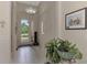 Spacious foyer with view into living room and kitchen at 13376 Creekside Ln, Port Charlotte, FL 33953