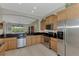 Modern kitchen with stainless steel appliances and dark countertops at 13376 Creekside Ln, Port Charlotte, FL 33953