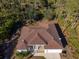 Single story house with brown roof and large backyard at 13478 Carrie Ave, Port Charlotte, FL 33953