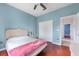 Bedroom with a queen bed, double doors, and wood floors at 13478 Carrie Ave, Port Charlotte, FL 33953